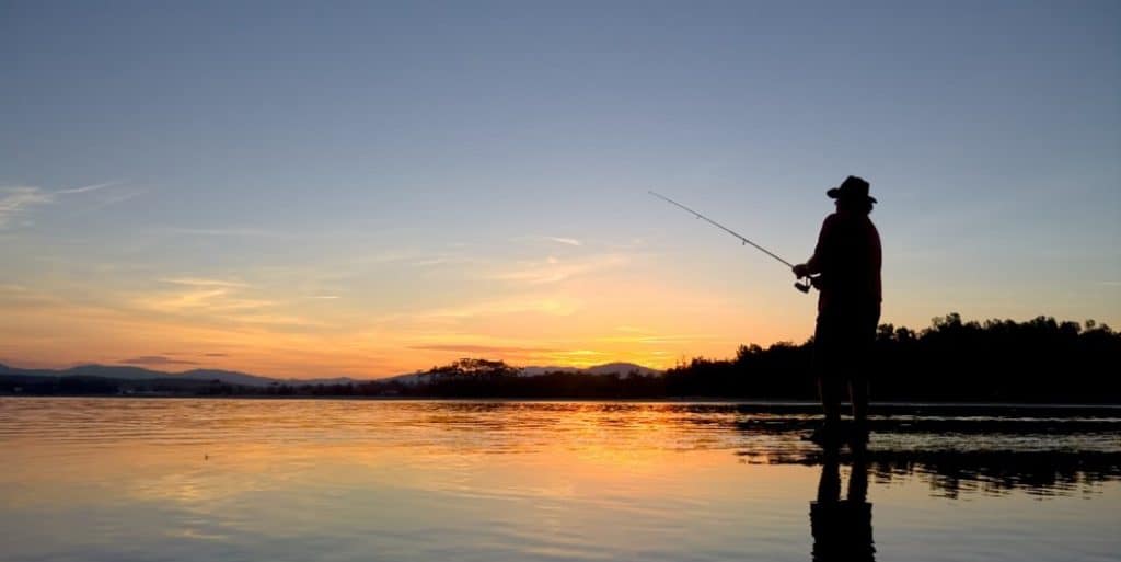 Man fishing on lake 