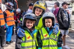 The Honda Snowy Ride - Three kids smiling in yellow vests